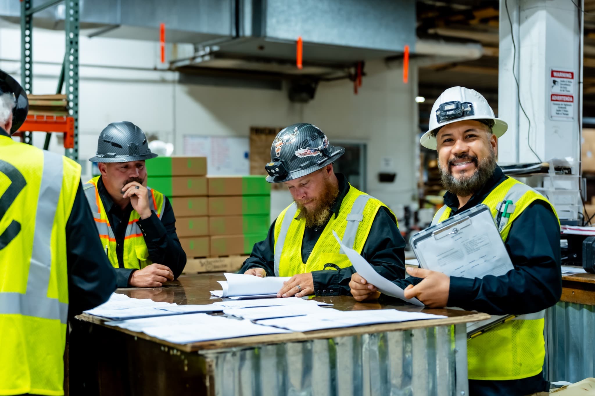 Crest team members reviewing construction plans